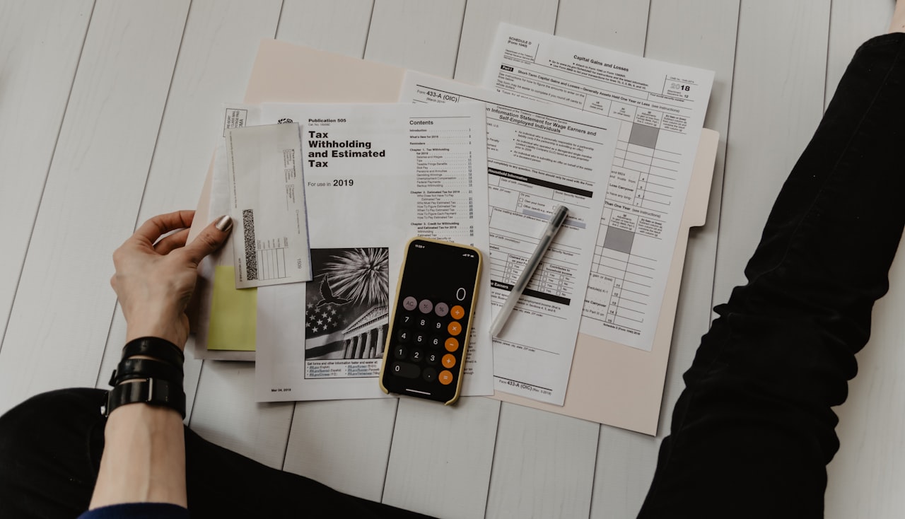 Financial documents and calculator on a desk